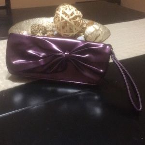 Conveniently cute purple clutch purse.